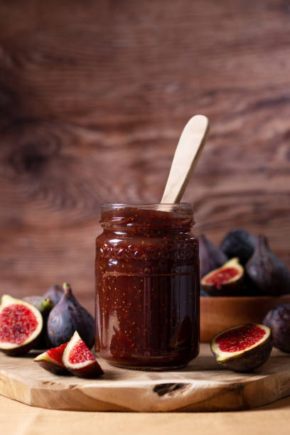 istock Fig jam or fig marmalade on wooden board with fresh, ripe figs 1441963893