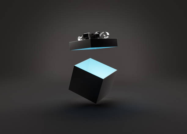 open gift box with light in a dark scene stock photo