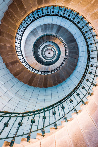 istock Spiral stairs and blue opaline inside the lighthouse 1441972228