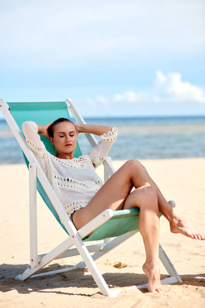 istock Woman Relaxing in Chaise-lounge 1441978279