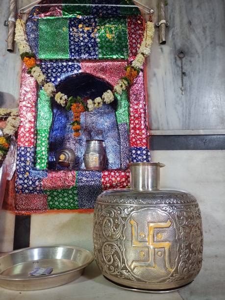 Statue of Poonrasar Balaji of Rajasthan and a view of Kalash made of silver Statue of Poonrasar Balaji of Rajasthan and a view of Kalash made of silver silverstone stock pictures, royalty-free photos & images