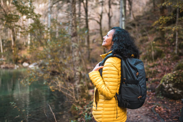 istock Active Mature Hispanic Female Hiking Alone In The Mountains 1441981506