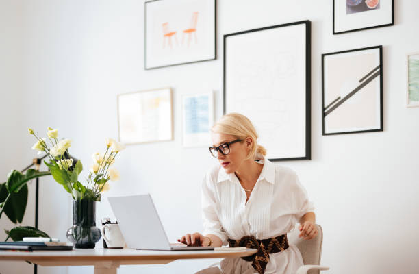 istock Serious Business Woman Using A Laptop Computer At Work 1441983594