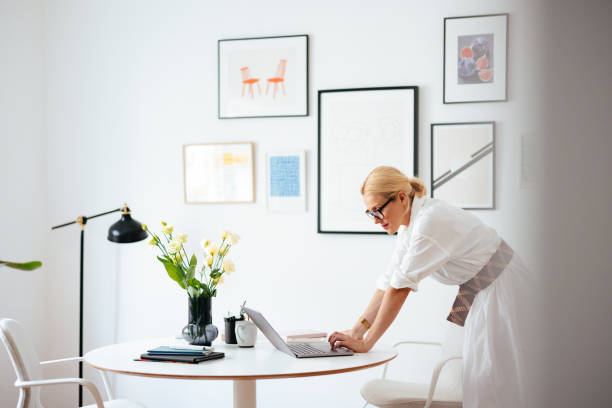 istock Serious Business Woman Using A Laptop Computer At Work 1441983597