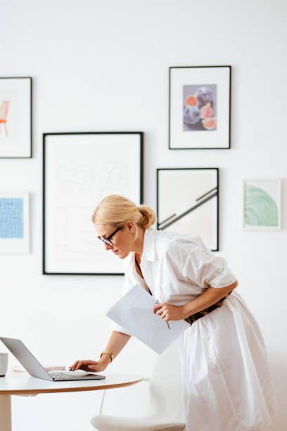 istock Serious Business Woman Using A Laptop Computer At Work 1441983627