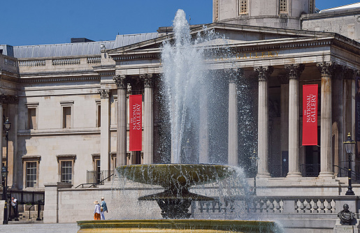 London, UK - July 22 2021: Fountain and The National Gallery at Trafalgar Square