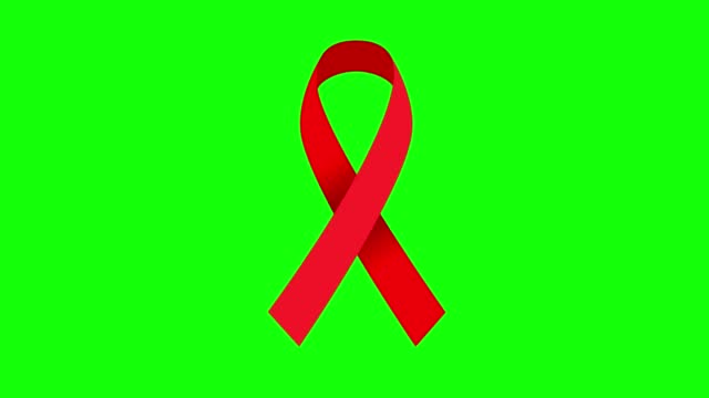 4K Red color mourning ribbon stock animation. Slow motion red color HIV/AIDS awareness video. Green screen for chroma keying.