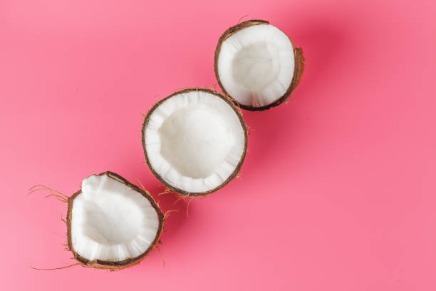 istock Coconut halves on a bright pink background 1441986649