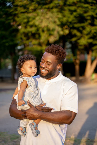 istock Happy dad with his daughter in a park 1441987060