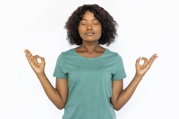 istock Calm young woman doing yoga 1441987550