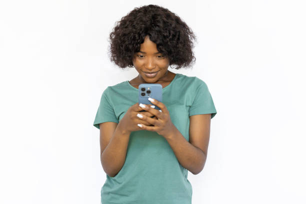 istock Cute young woman texting on smartphone 1441987567