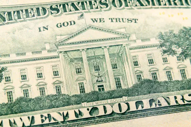 Macro view of the White House on back of the US twenty dollar bill.