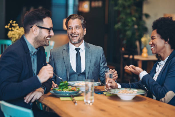 istock Business people eating together 1441990109