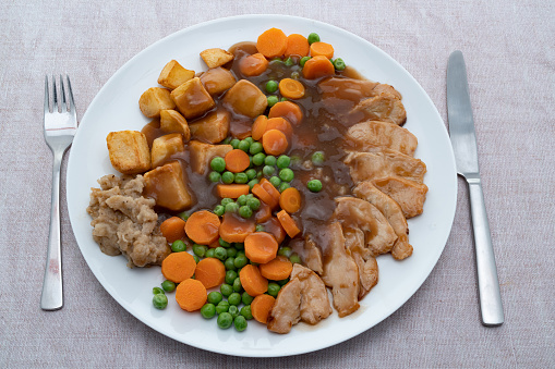 Roast chicken dinner with vegetables and gravy