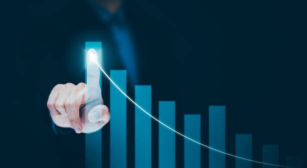 istock Businessman holding tablet bar graph of analytics and financial, Changes in new planning, Business growth, ideas and perspectives, Stock investment, and dividends yield from business in the new year 1441993270