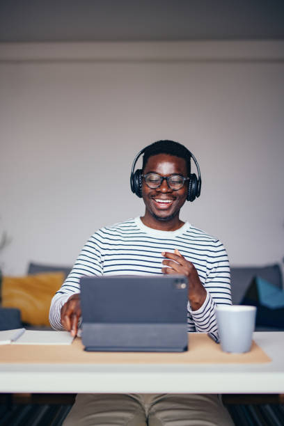 istock Smiling Businessman Talking On A Video Call At Home 1441994258