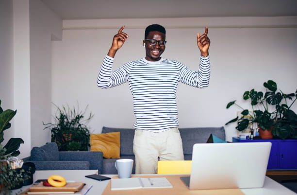 istock Excited Man Dancing And Singing At Home 1441994355