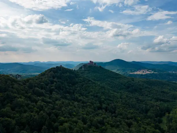 Drone shot of the palatine forest with castle Trifels on a cloudy day.