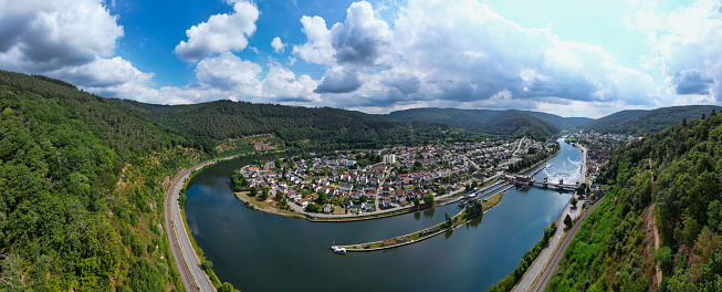 Drone view of a loop in the river Neckar near Heidelberg with cloudy summer sky. Shot in Hirschhorn.