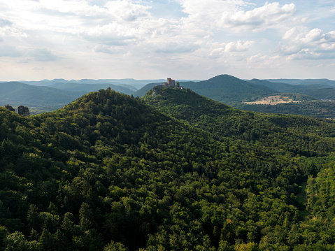 Drone shot of the palatine forest with castle Trifels on a cloudy day.