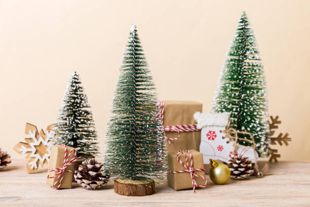 istock Christmas composition. Gifts, small tree, branches and craft DIY decorations on white background. New year concept. Christmas home decoration Flat lay, top view, copy space 1441995197