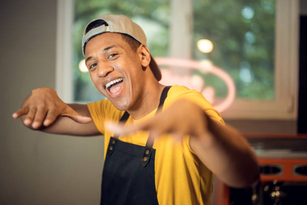 istock Merry barista having fun in the workplace 1441996581