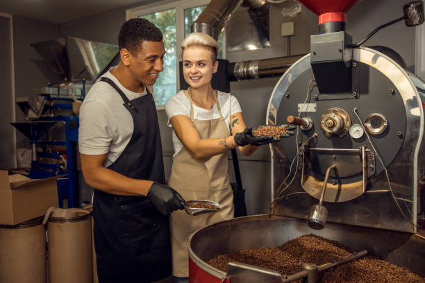 istock Two people working together in a small coffee company 1441996777