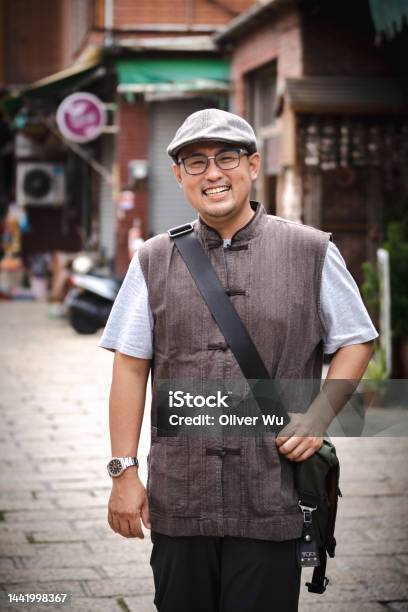 A Local Tour Guide With Chinese Vintage Style Outfit Stock Photo - Download Image Now