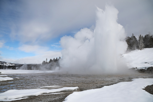 Grand Geyser Eruption in Winter\nYellowstone National Park