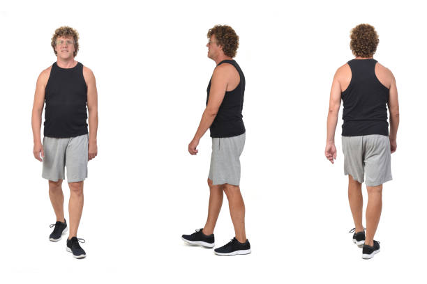 istock back, side and front view of the same man with sportswear walking on white background. 1442000400