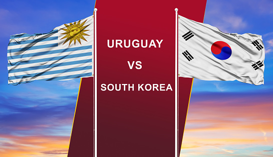 Uruguay vs. South Korea two flags on flagpoles and blue cloudy sky background.Soccer matchday template