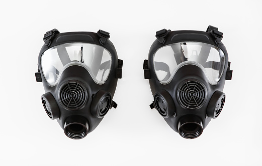 Gas mask without filter on white background. Two respirators