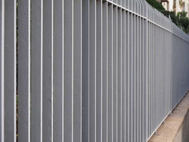 istock grey metal fence 1442004085