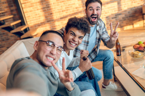 istock Funny guys taking selfies with the smartphone camera 1442007011