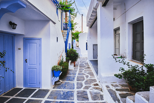 Mykonos Town Old Port Streets. Pedestrian walkway through the idyllic narrow streets with whitewashed traditional homes and buildings, colorful doors and window blinds. Mykonos Old Town, Mykonos, Cyclades Islands, Greece, Southern Europe, Europe.