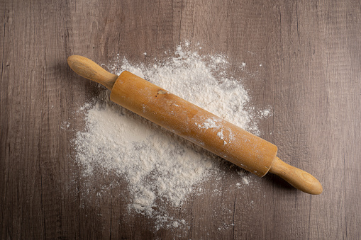 Rolling pin on wheat flour