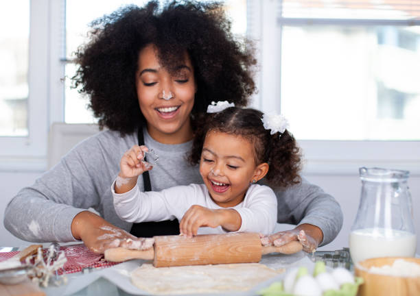 istock Mother and daughter are baking together 1442015428