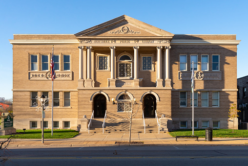 Janesville, Wisconsin - United States - November 7th, 2022: Exterior of the old Janesville Public Library building, built in 1901, on a sunny Fall morning.