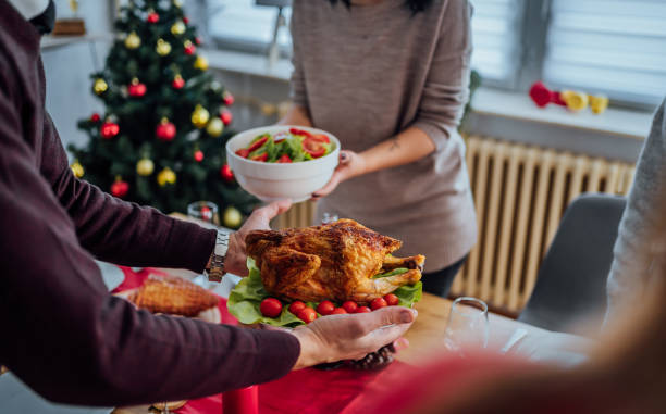 istock Couple setting up the table for Christmas lunch 1442016742