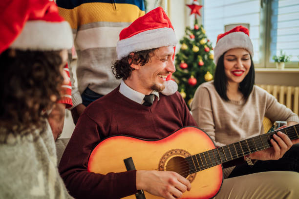 istock Happy friends celebrating Christmas together 1442018898