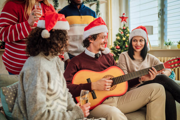 istock Happy friends celebrating Christmas together 1442018922