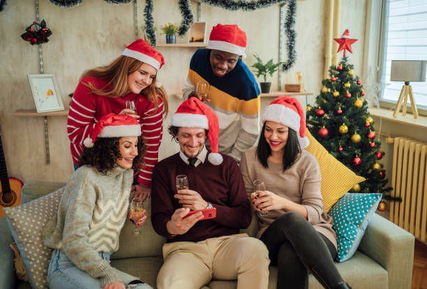 istock Young friends looking at smartphone 1442018955