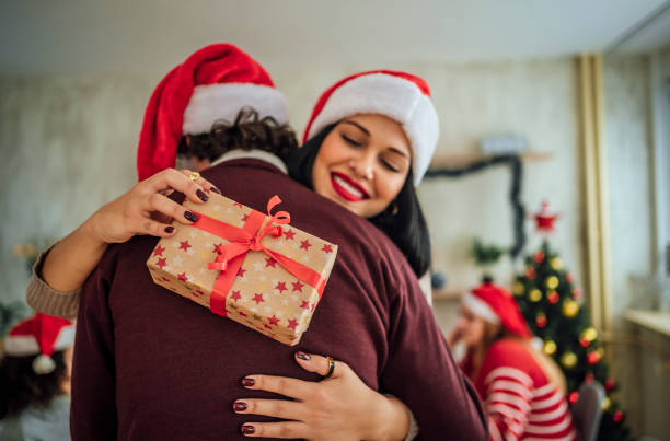 istock Friends exchanging gifts for Christmas 1442019073