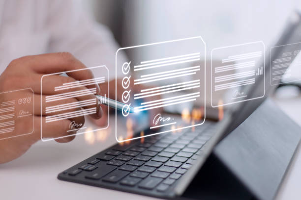 istock Paperless workplace ideas, e-signing, electronic signature, document management. A businessman signs an electronic document on a digital document on a virtual screen using a stylus pen. 1442022572
