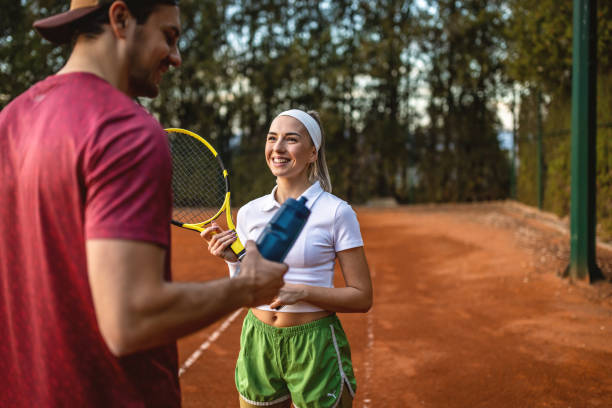 istock Young couple at the tennis courts 1442026672