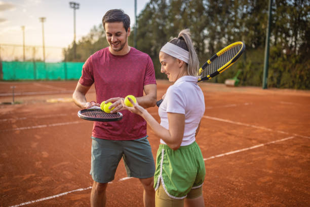 istock Couple at the tennis courts 1442026698