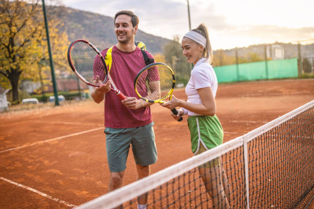 istock Couple at the tennis courts 1442027175