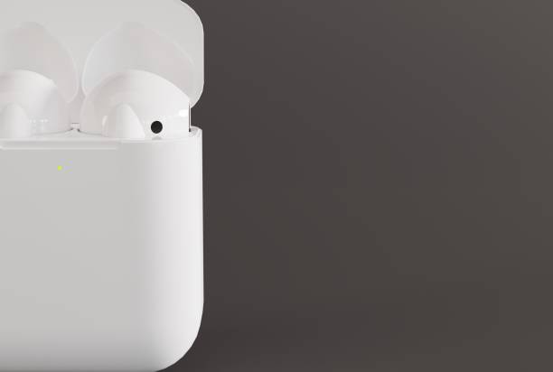 istock Wireless earbuds in a box on a dark background. 1442028078