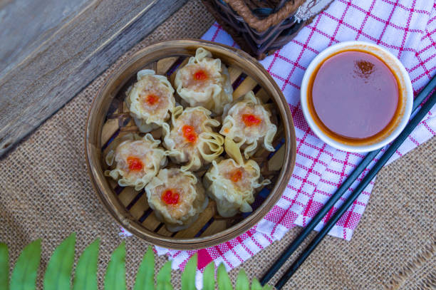 istock Dim Sum, Asian food served in a bamboo container. 1442032983