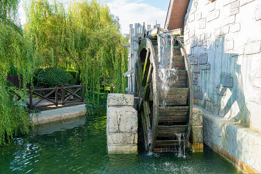 the water mill wheel is large. photo